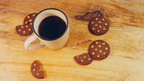 Coffee and Cookies on a Wooden Board