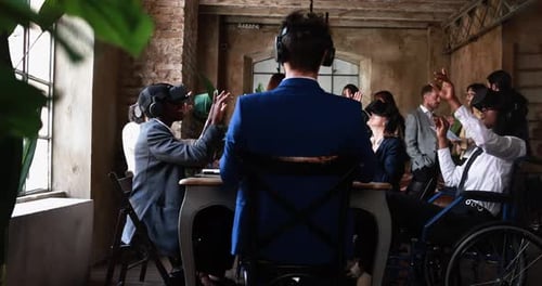 Business people wearing virtual reality goggles inside office