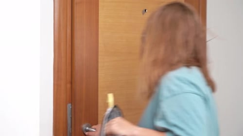 Woman Uses Key to Enter Room