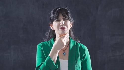 Woman Touching Sore Throat in Discomfort