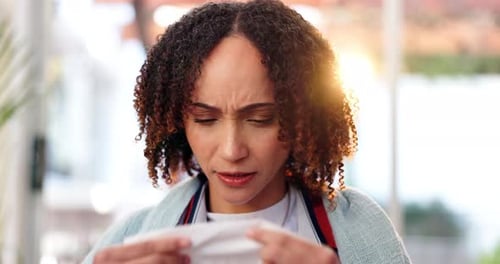 Woman Uses Tissue to Blow Her Nose