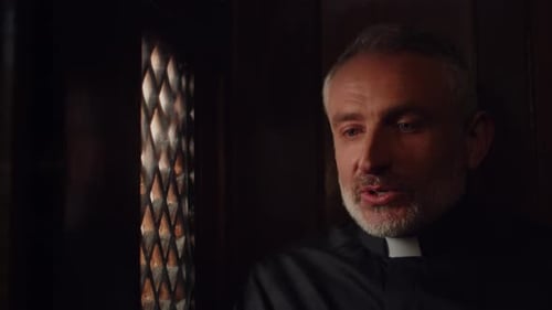 Catholic Priest Talking to Parishioner in Confessional Booth Pastor Listening the Confession in