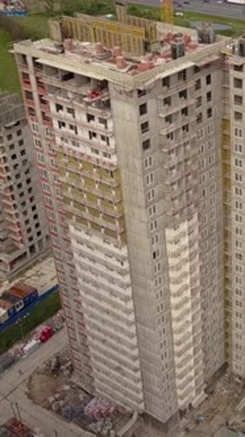 Vertical of Aerial Shot of Crane and Beams Construction New Modern Building Work Builders and