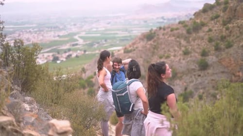 Hikers group walk along a rout in the mountain.