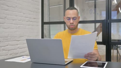 Man Working on Computer at Modern Office