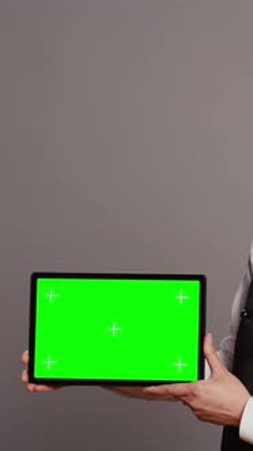 Vertical Video Woman Waitress Holding Tablet with Greenscreen Display on Camera
