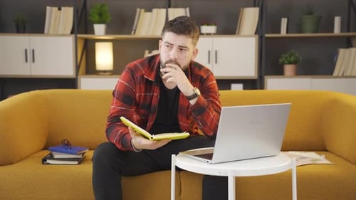 Thoughtful businessman in home office.