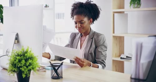 4k video footage of a young attractive businesswoman working in her office