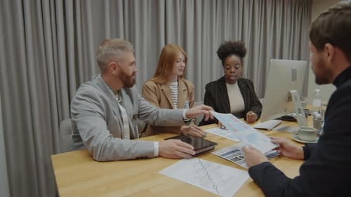 Team of Business People Discussing Financial Statistics on Office Meeting