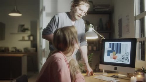 Woman Working at Desk with Partner