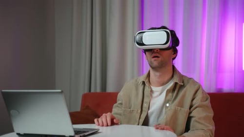 Man Using Virtual Reality Headset at Home