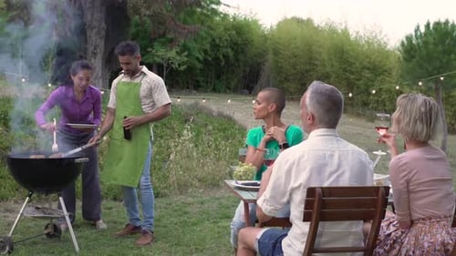 Friends Enjoying Barbeque on a Summer Day
