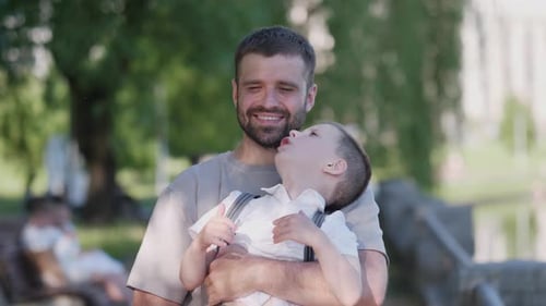 Happy Father and Son in Summer Park Portrait