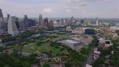 Aerial View of a Lush Green Parks in Austin with Skyscrapers Background Vibrant Cityscape and