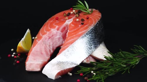 Trout Steaks Rotation Video. Raw Slices with Perfect Texture of Uncooked Red Fish. Sea Food