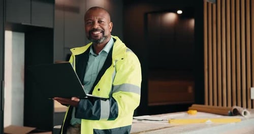 Face, laptop and renovation with black man in kitchen for home improvement or upgrade project