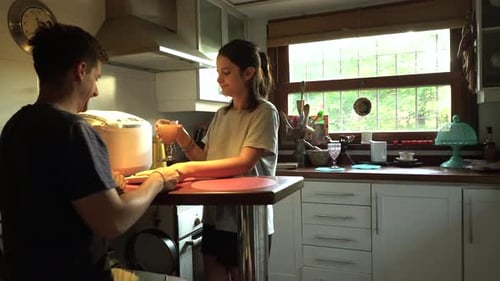 Young Couple Sharing Breakfast in Bright Kitchen