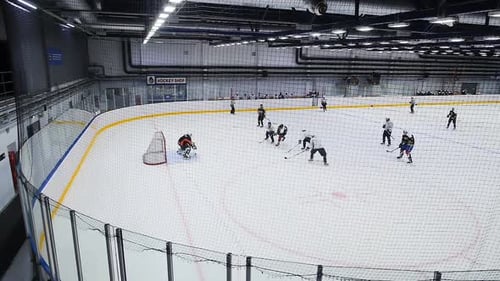 Skilled Players Attack Opposite Team Gate on Ice Arena
