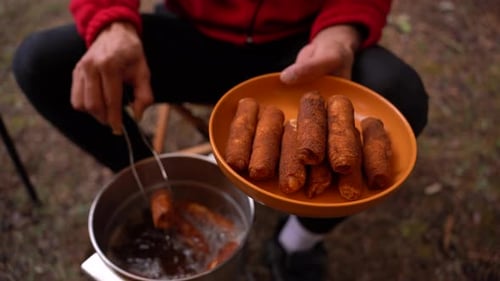 Preparing Fried Food Outdoors in the Forest