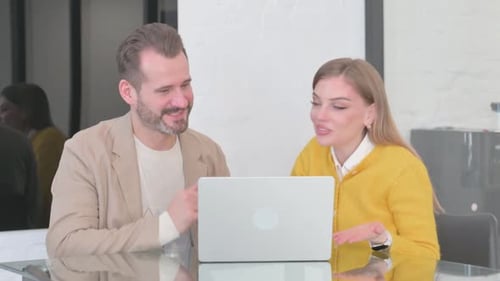 Colleagues Talking on Video Call in Office