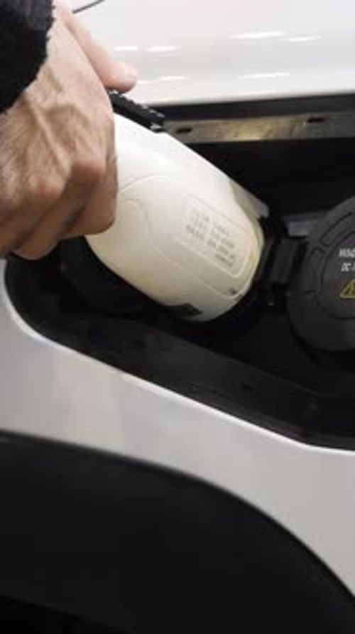 Charging for an Electric Car MediaA White Car at a Special Gas Station Where Electric Cars are