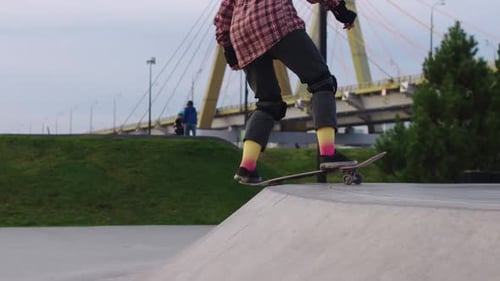 Young Woman Teen Skater Riding a Ramp