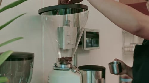 Barista is making coffee in coffee shop