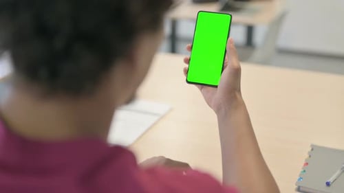 African Man Using Smartphone with Green Screen