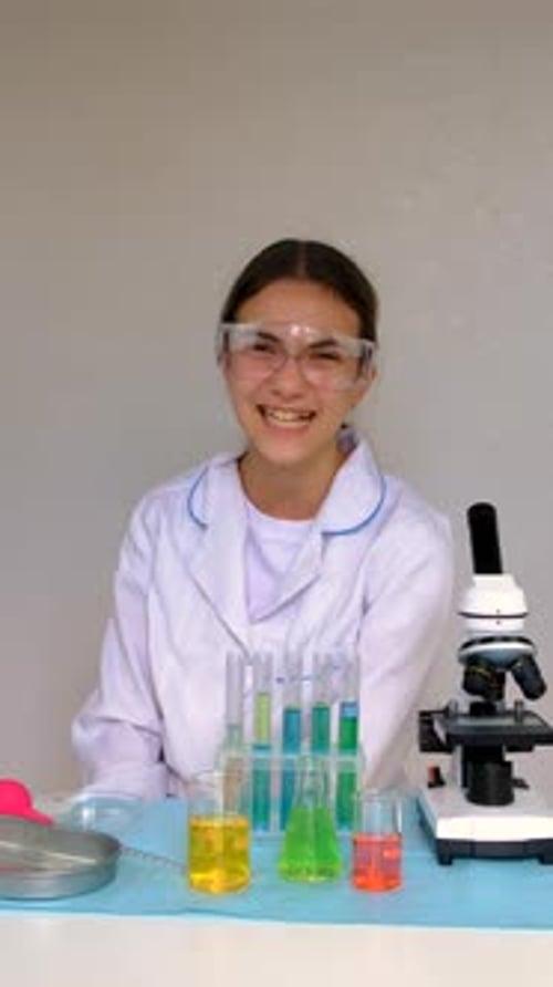 Smiling Teen Girl Working in a Lab