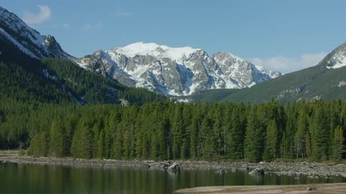 The Snowcapped Peaks, Steep Cliffs And Dense Forests Of The Absaroka Mountain Range Near Yellowst...
