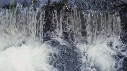 White frothy bubbling river waterfall cascade splashing Close-Up