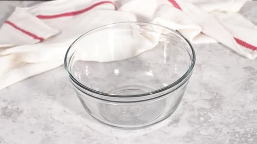 Step By Step Mixing Ingredients in a Glass Mixing Bowl to Prepare Chocolate Mug Cakes
