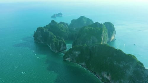 Aerial view of iconic tropical turquoise water Pileh Lagoon surrounded by limestone cliffs, Phi Phi