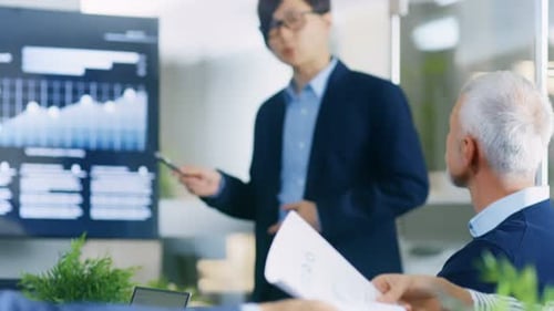 Professionals Attending Business Meeting in Modern Office