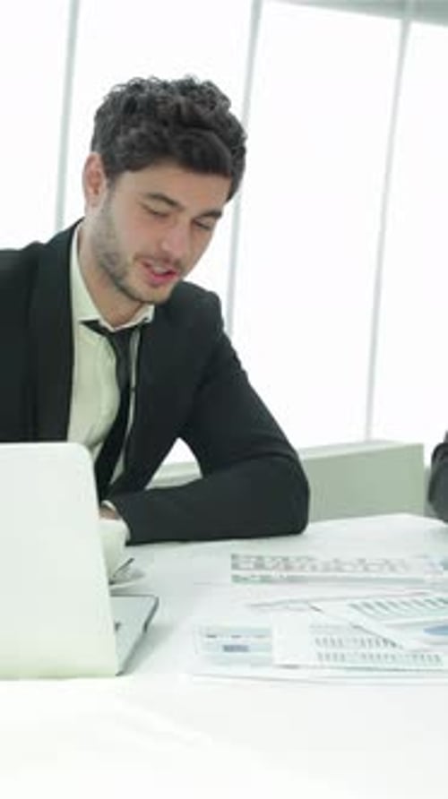 Engaging Dialogue Among Young Professionals in a Sleek Office Setting