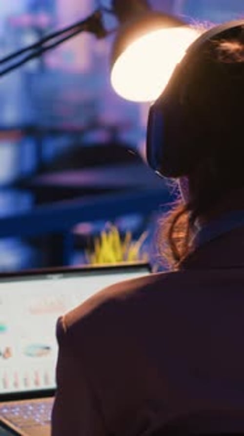 Vertical Video Executive Manager Looking at Marketing Statistics on Pc