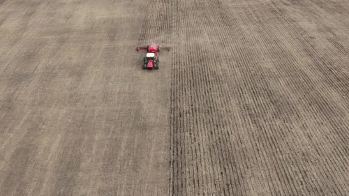 Tractor With Plow In The Field