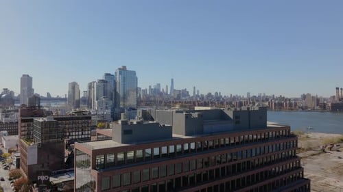 Camera Pans Next to Modern Residential High Rise in Brooklyn with One World Trade Center and