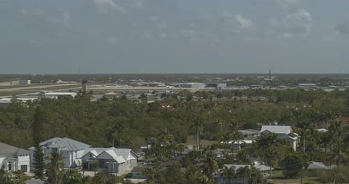 Naples Florida Aerial v1 right to left panning view of the runway at naples airport - DJI Inspire 2,