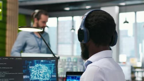 Programmer in Office Relies on AI Machine Learning to Automate Repetitive Tasks