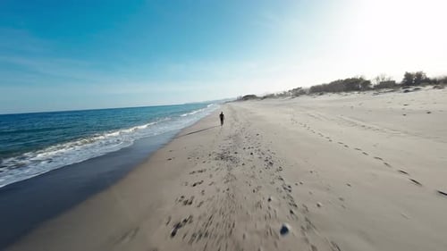 Man Ending His Run In Front Of The Ocean