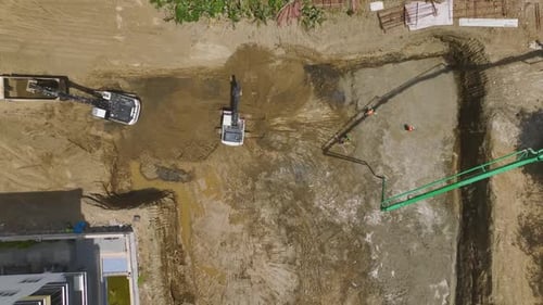 Aerial View Initial Construction Stage Concrete Pouring and Heavy Machinery