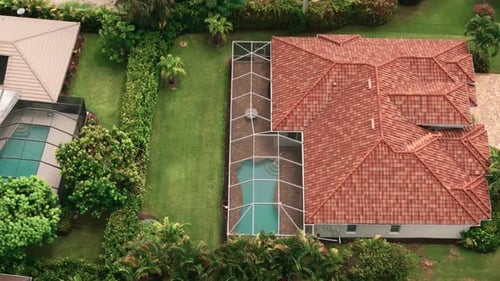 Aerial Above Wide View of Screened in Pool and Lanai in Florida House Top Down Move Shot