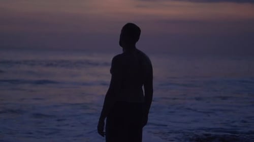 Pensive Lonely Man Admire Sea in Evening 30s