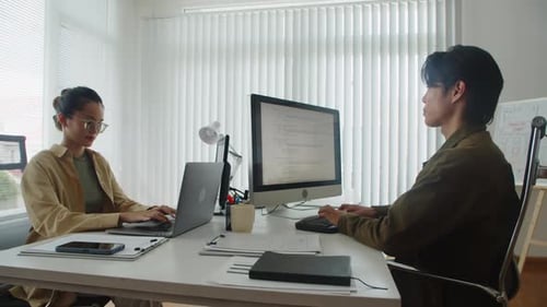 Programmers Working on Codes during Software Developing in Office