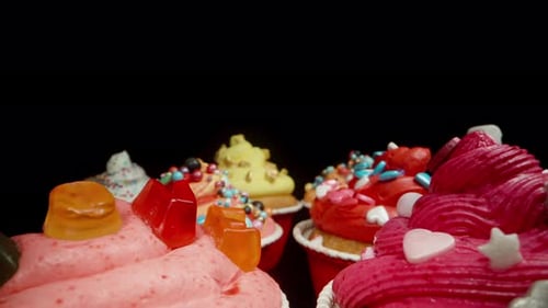 Iced Cupcakes with Sprinkles and Candies