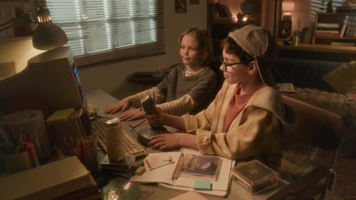 Two Boys Playing Videogame using Joystick Computer in 90s