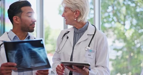 X ray, consulting and teamwork of doctors in hospital with tablet discussing test results