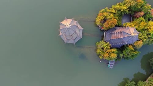 Sunrise aerial view of Sun and Moon Twin Pagodas at Shanhu Lake, Guilin, China