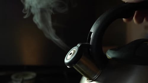 172k. The water in the kettle boils and steam comes out. Making coffee or tea.